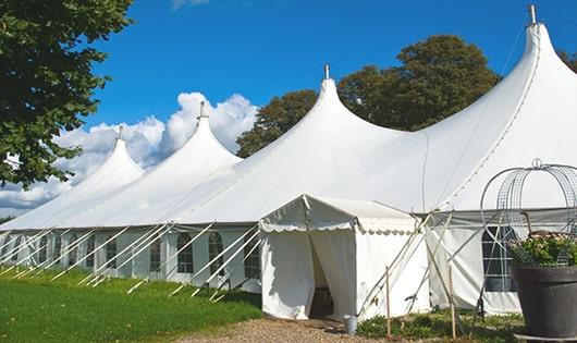 a line of sleek and modern portable restrooms ready for use at an upscale corporate event in Carville